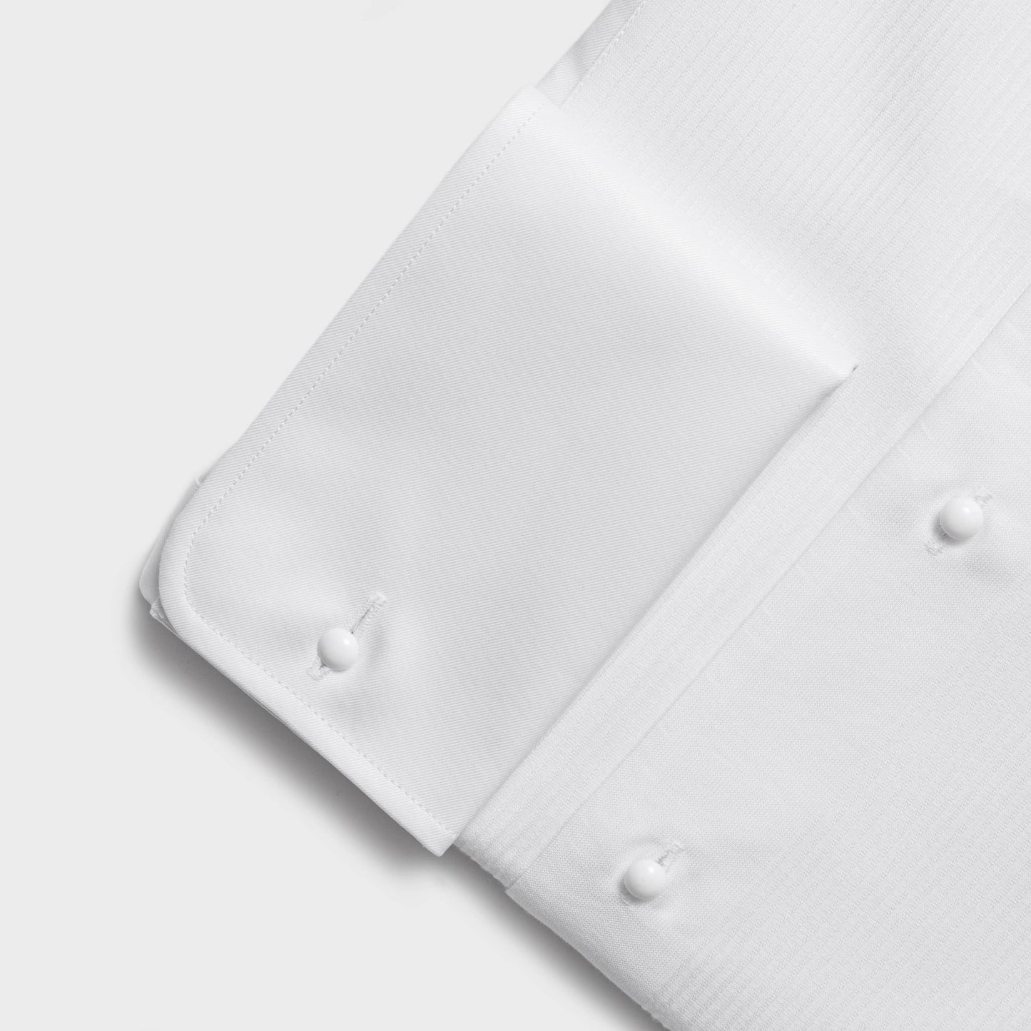 White cotton twill evening shirt with ribbed pleat and double cuffs